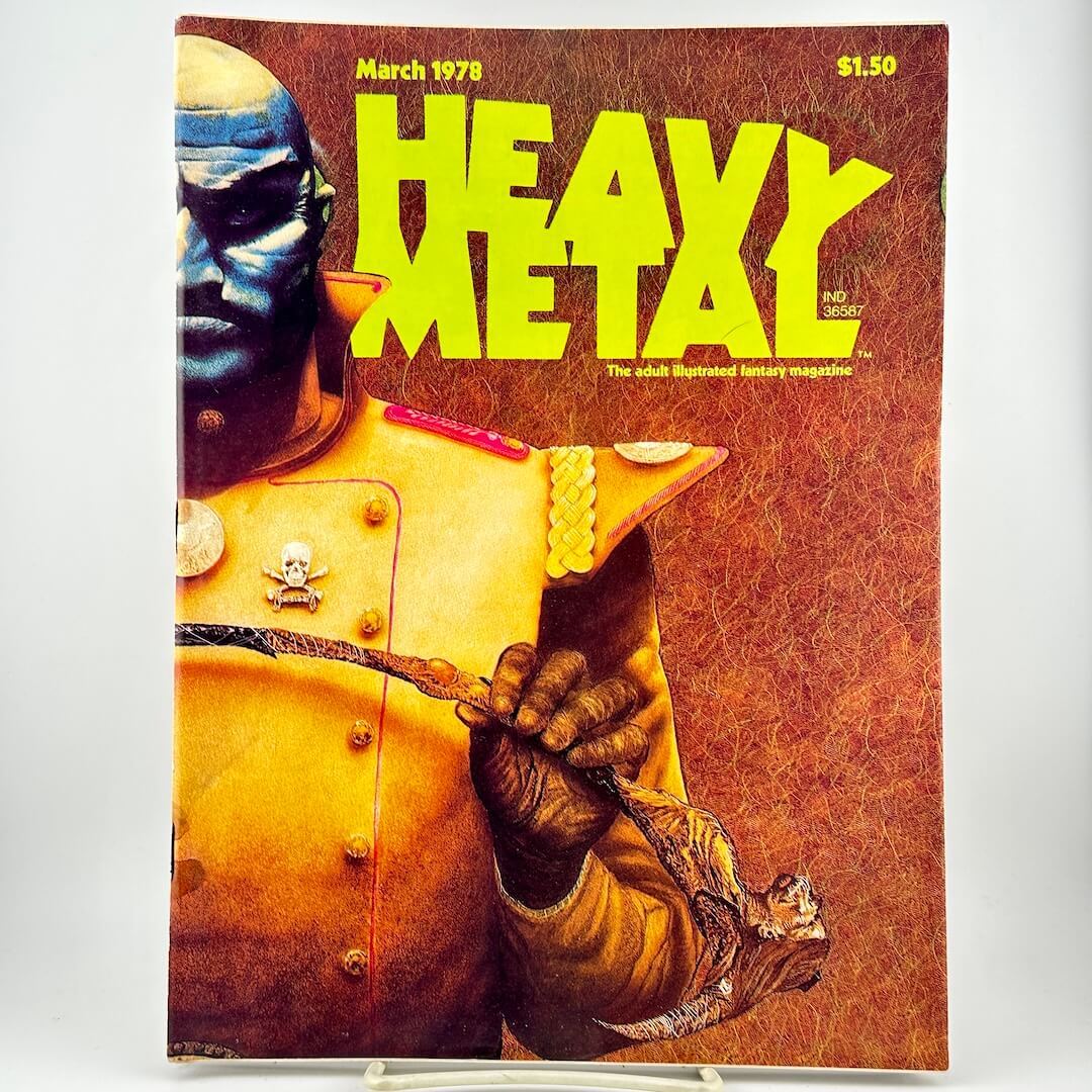 Magazine cover featuring a large yellow title over an illustrated cover with a blue-faced figure in a gold uniform.