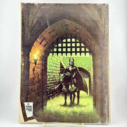 Back cover of magazine with horse-mounted person in armor behind a castle gateway. 