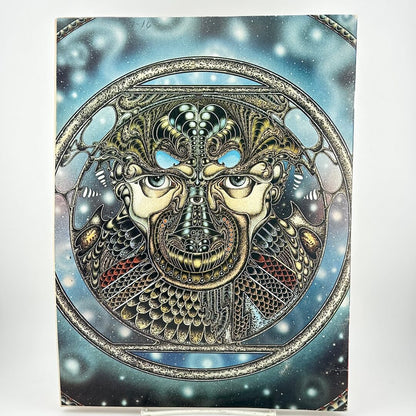 Back cover of magazine with intricate illustration of face in geometric patterns. 