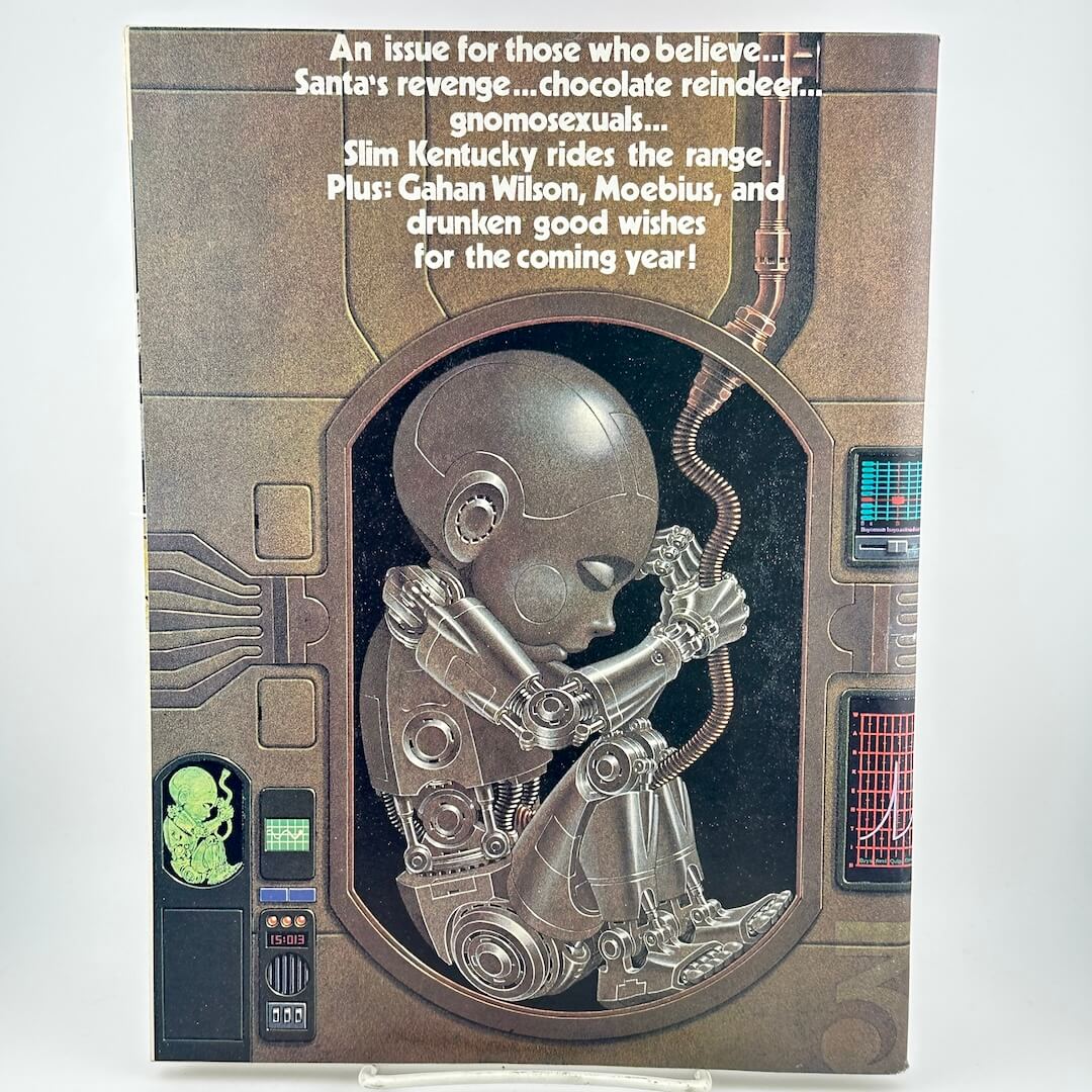 Back cover of magazine with cyborg child in womb and list of highlighted contents. 
