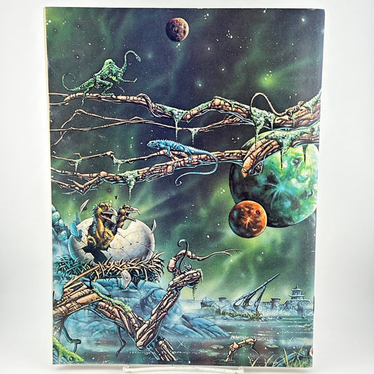Back cover of magazine with futuristic landscape and creature emerging from cracked egg. 