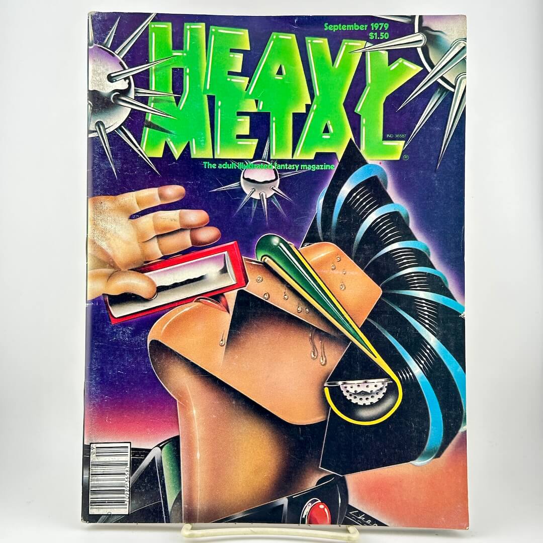 Heavy Metal magazine with a bold cover illustration with the title in large green letters and a futuristic sci-fi design on a purple background.