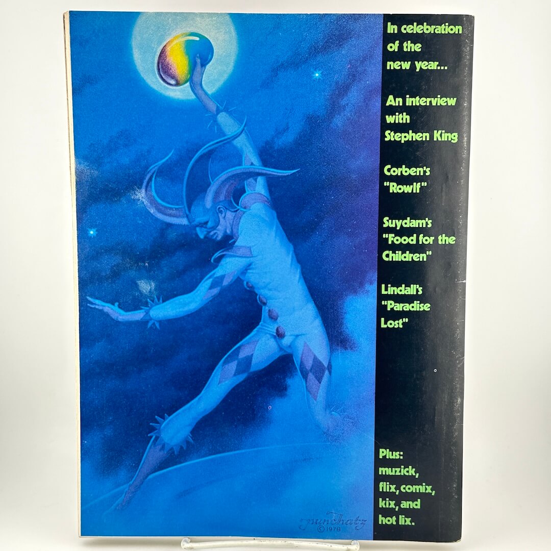 Back cover of magazine with jester figure holding orb aloft, with text along right side of featured contents. 