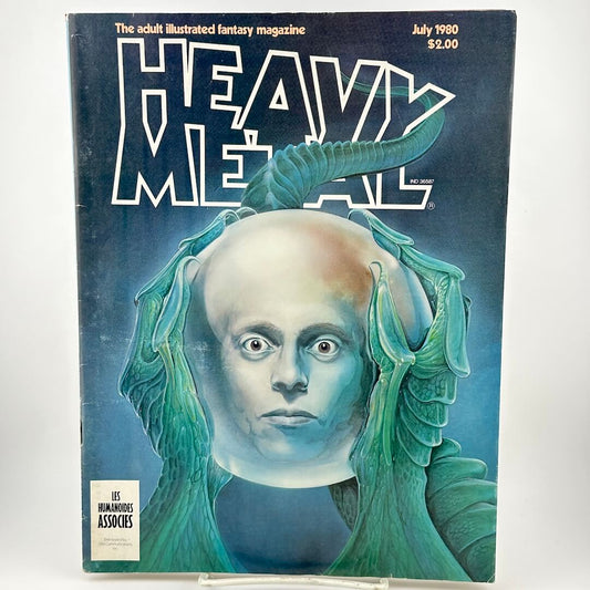 "Heavy Metal" magazine cover cover alien hands holding orb with head inside. 