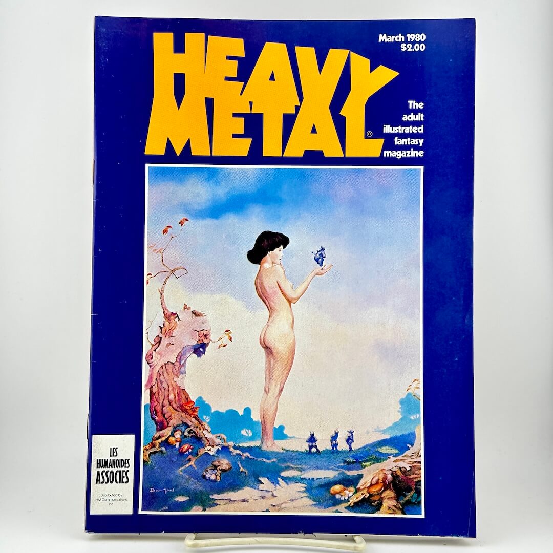 Heavy Metal magazine with a blue cover with yellow title & a fantasy illustration of a nude woman holding a blue creature. 