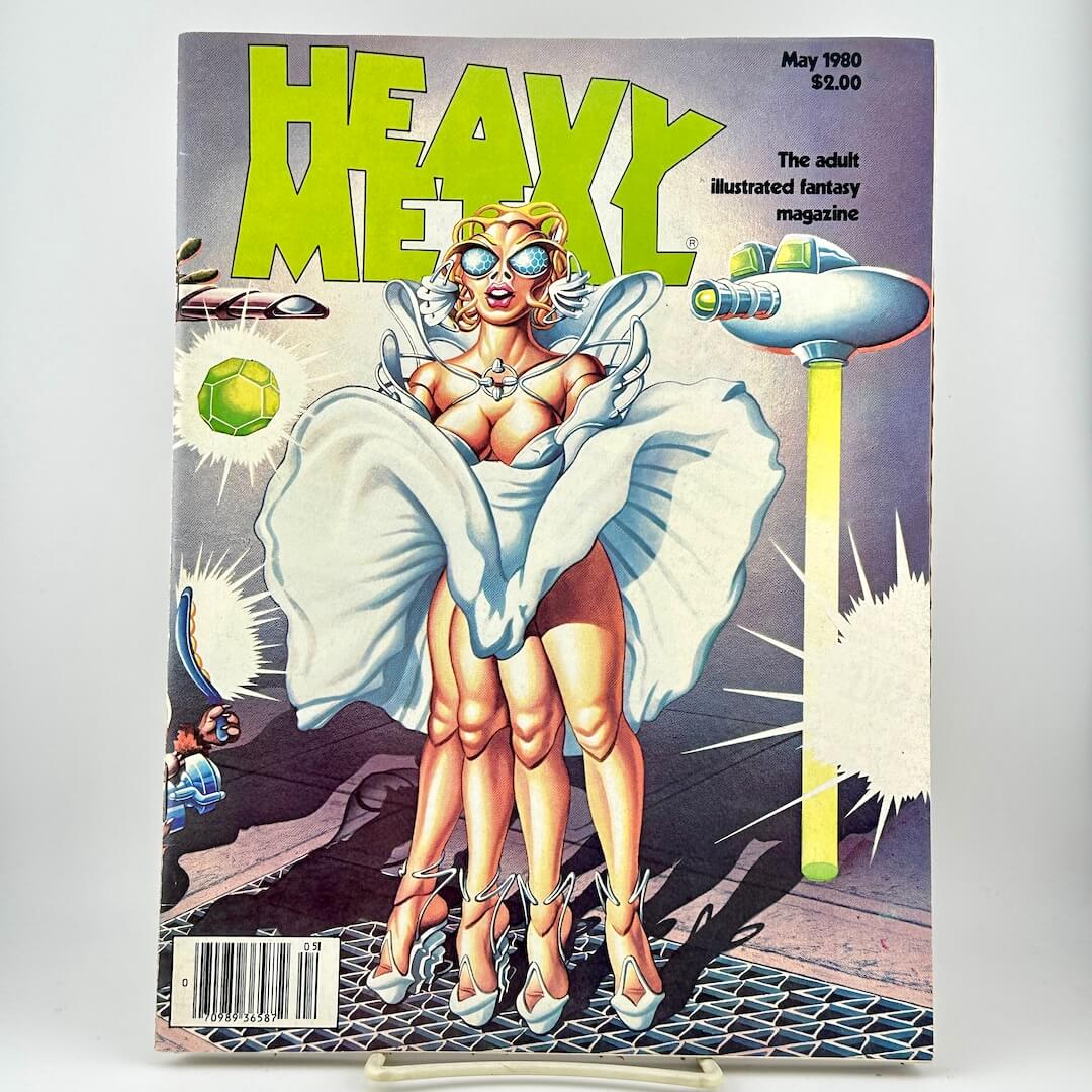 Heavy Metal Magazine with a cover illustration of a blonde woman in a white dress with sunglasses, and sci-fi artwork.
