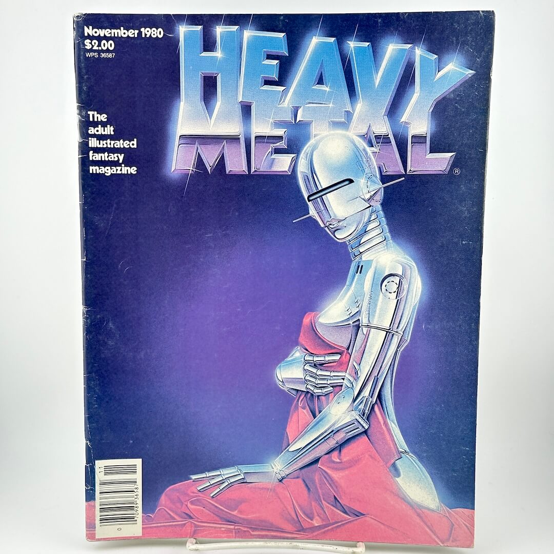 "Heavy Metal" magazine cover of chrome robot woman holding blanket up to cover herself. 