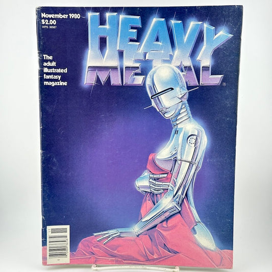 "Heavy Metal" magazine cover of chrome robot woman holding blanket up to cover herself. 