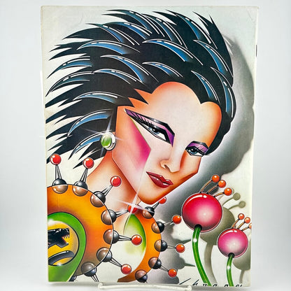 Back cover of magazine with futuristic woman head with spiky hair. 