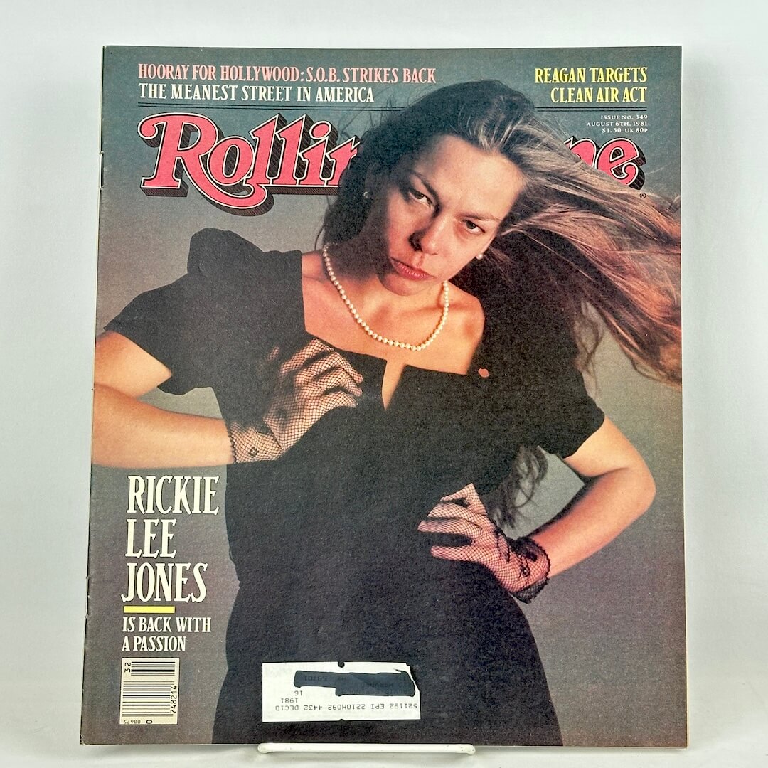 Vintage Rolling Stone magazine with Rickie Lee Jones in black dress in fashion pose on cover. 