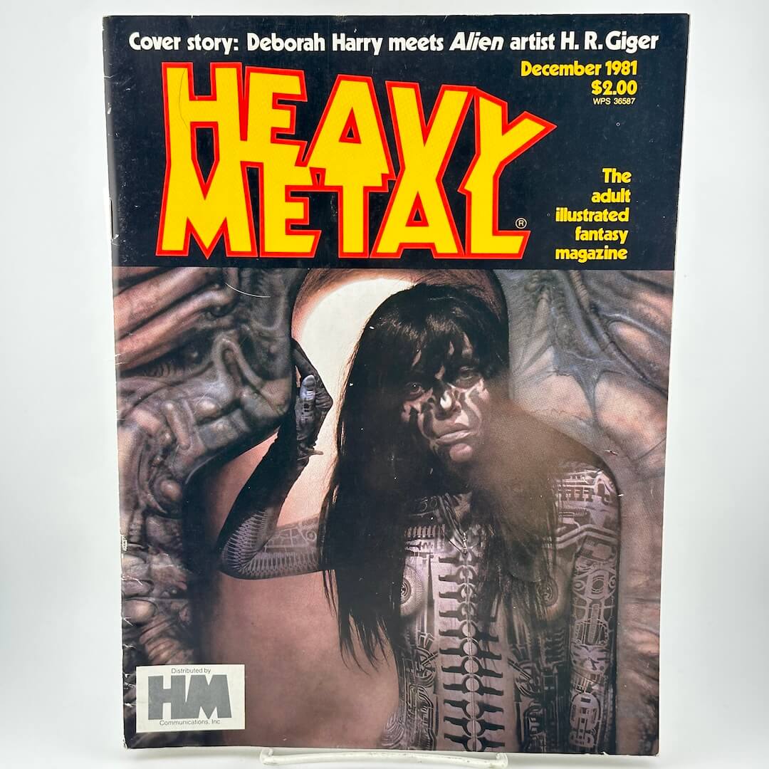 "Heavy Metal" magazine cover with illustration of woman with mechanical body paint emerging from doorway. 