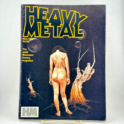 Heavy Metal magazine cover with nude woman on dark background featuring dead trees and night sky. 