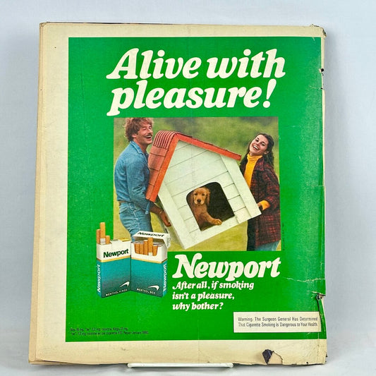 A vintage Newport cigarette advertisement on back cover, with a green background, white text. 
