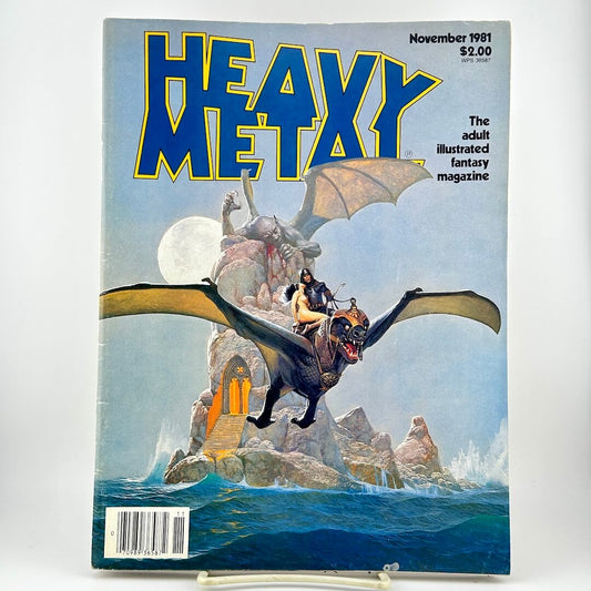 Heavy Metal magazine featuring fantasy cover art of a rider on a dark dragon flying over rocky seas under a full moon. 