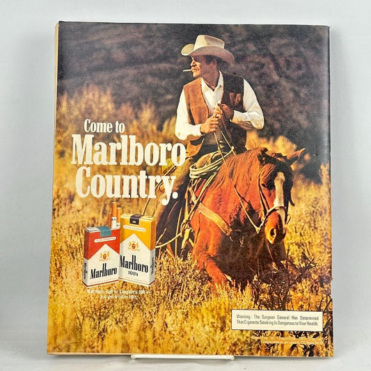 Back cover of magazine featuring full size Marlboro ad with a smoking, horse riding cowboy as main image. 