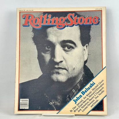 A vintage Rolling Stone magazine cover featuring a black-and-white portrait of John Belushi.