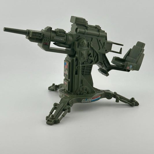 Army green anti aircraft cannon style gun with seat. Features G.I. Joe and American flag stickers. 