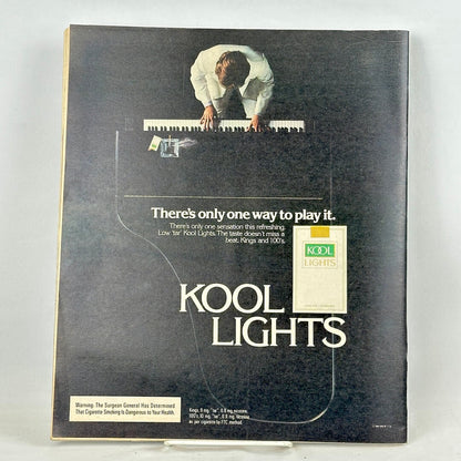 Back cover of magazine featuring an ad for Kool Lights cigarettes with image of grand piano from above.