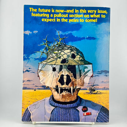 Back cover of magazine with illustration of skeleton with visor against futuristic landscape. 