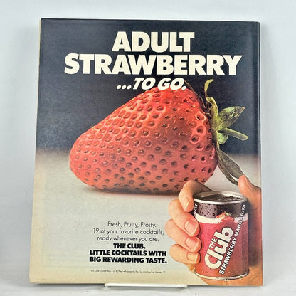Back cover of magazine with ad for The Club Strawberry Margarita with enlarged image of a strawberry. 