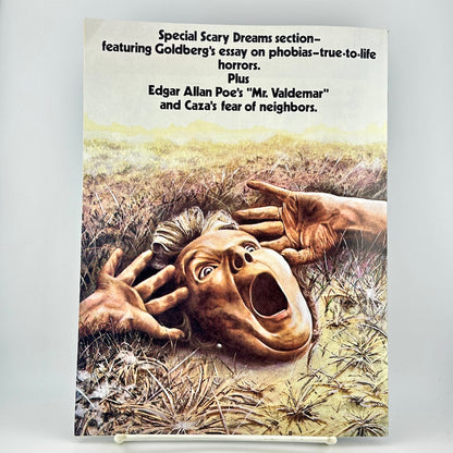 back cover of magazine featuring a surreal illustration of a screaming face and hands emerging from a grassy field.