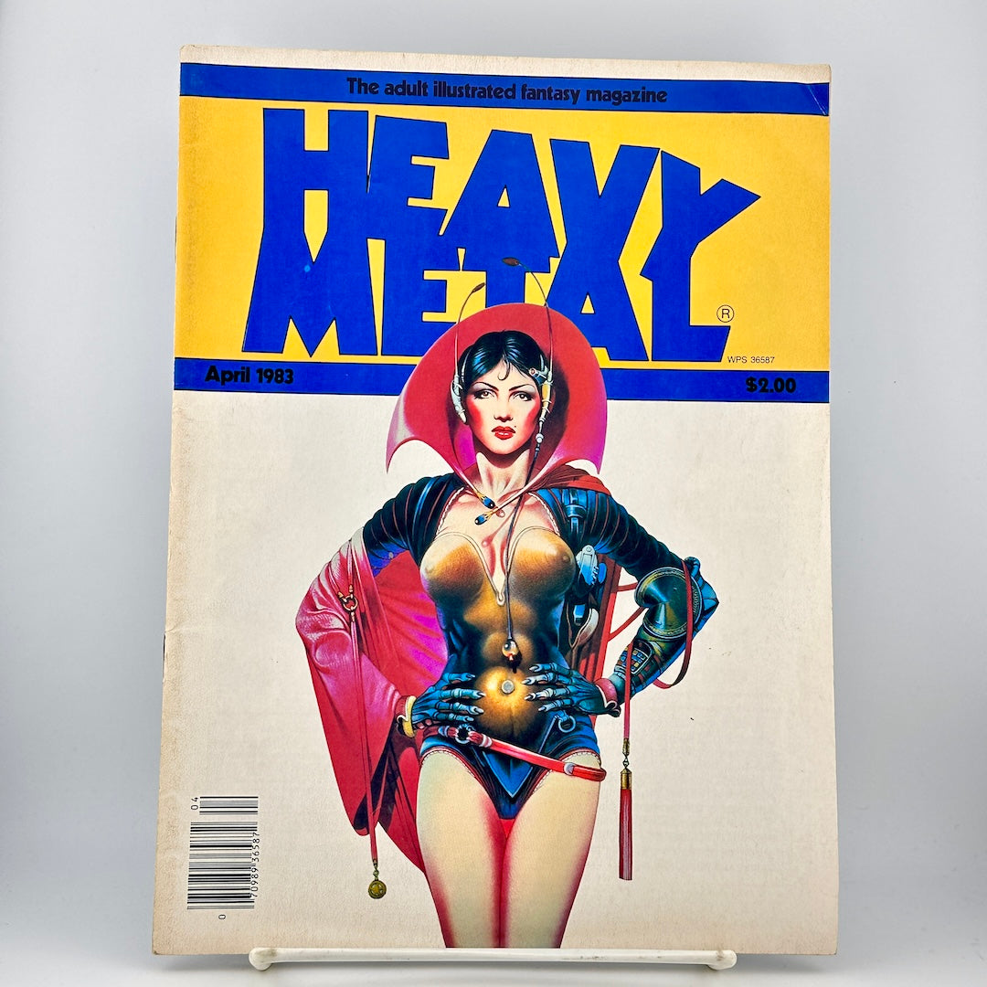 Vintage Heavy Metal magazine featuring an illustrated pin-up style female character in a red and blue outfit.