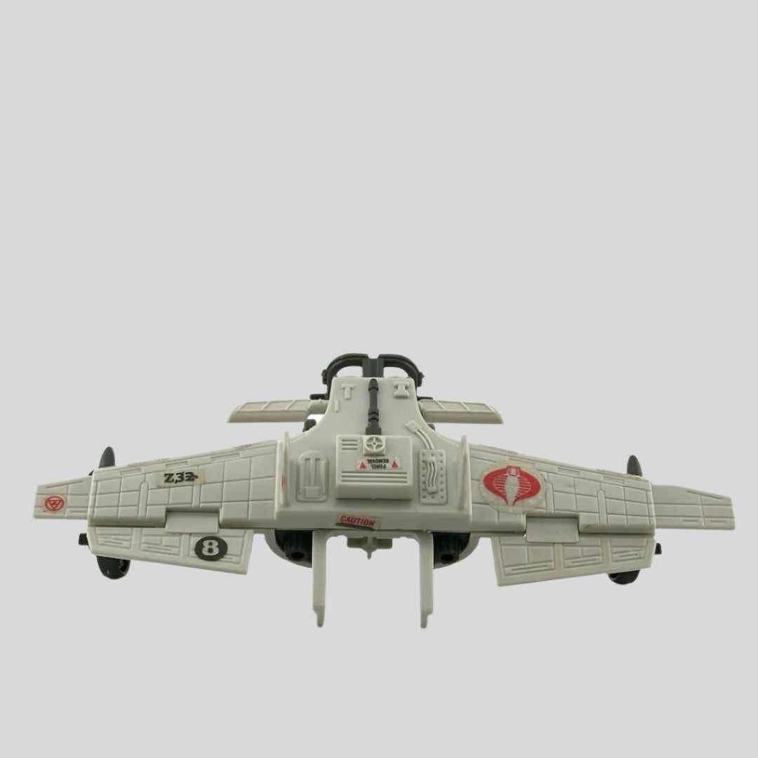 Light grey airplane-like wings with grey wheels & landing gear, red snake decals throughout, 3 bombs suspended on bottom. 