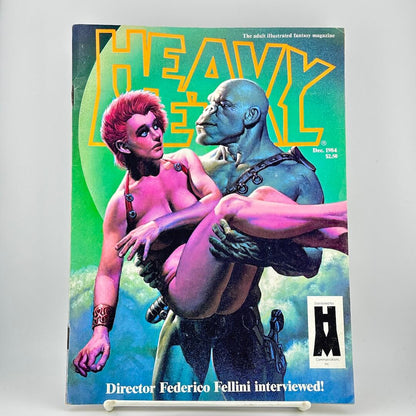 Heavy Metal magazine cover with illustrated cover art showing two nude figures against a green and blue background.