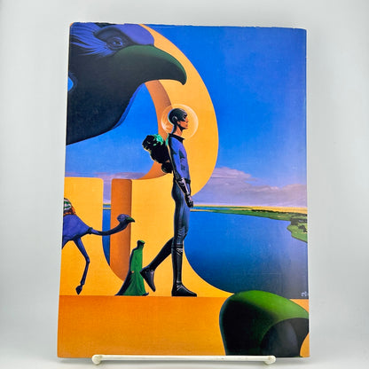 Back cover of magazine with illustration of a figure in a blue suit walking beside a large bird and landscape.