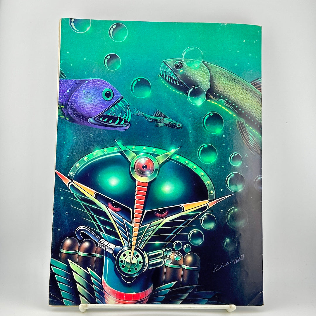 Back cover of magazine featuring a colorful underwater scene with purple  & green fishes, bubbles, & a futuristic creature.