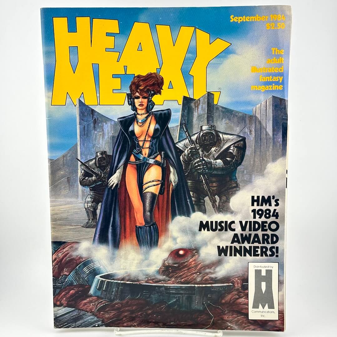 "Heavy Metal" magazine cover with illustration of futuristically dressed woman with robots walking futuristic landscape. 