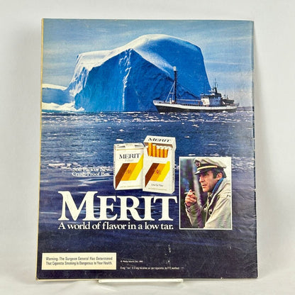 Back cover of magazine with full page ad for Merit cigarettes featuring image of iceberg and ship. 