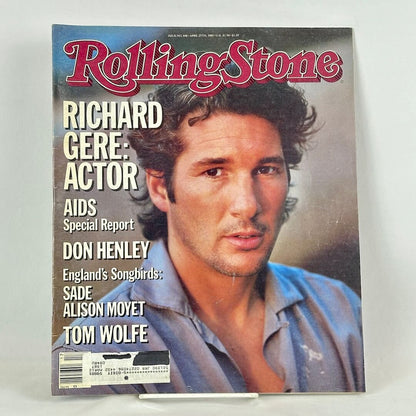 A vintage issue of Rolling Stone magazine on a white surface, featuring a close-up portrait of Richard Gere.