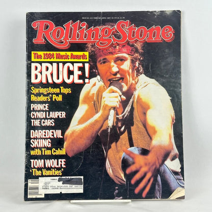 A vintage Rolling Stone magazine cover featuring Bruce Springsteen on the cover.