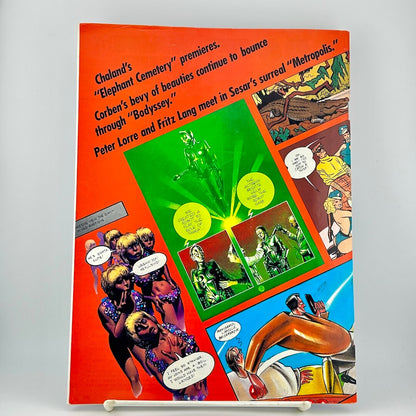 Back cover of magazine featuring a bright orange-red background with multiple colorful comic panels, & black text.