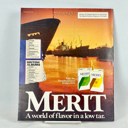 Back cover of magazine with full page ad for Merit cigarettes featuring image of  ships in front of sunset. 