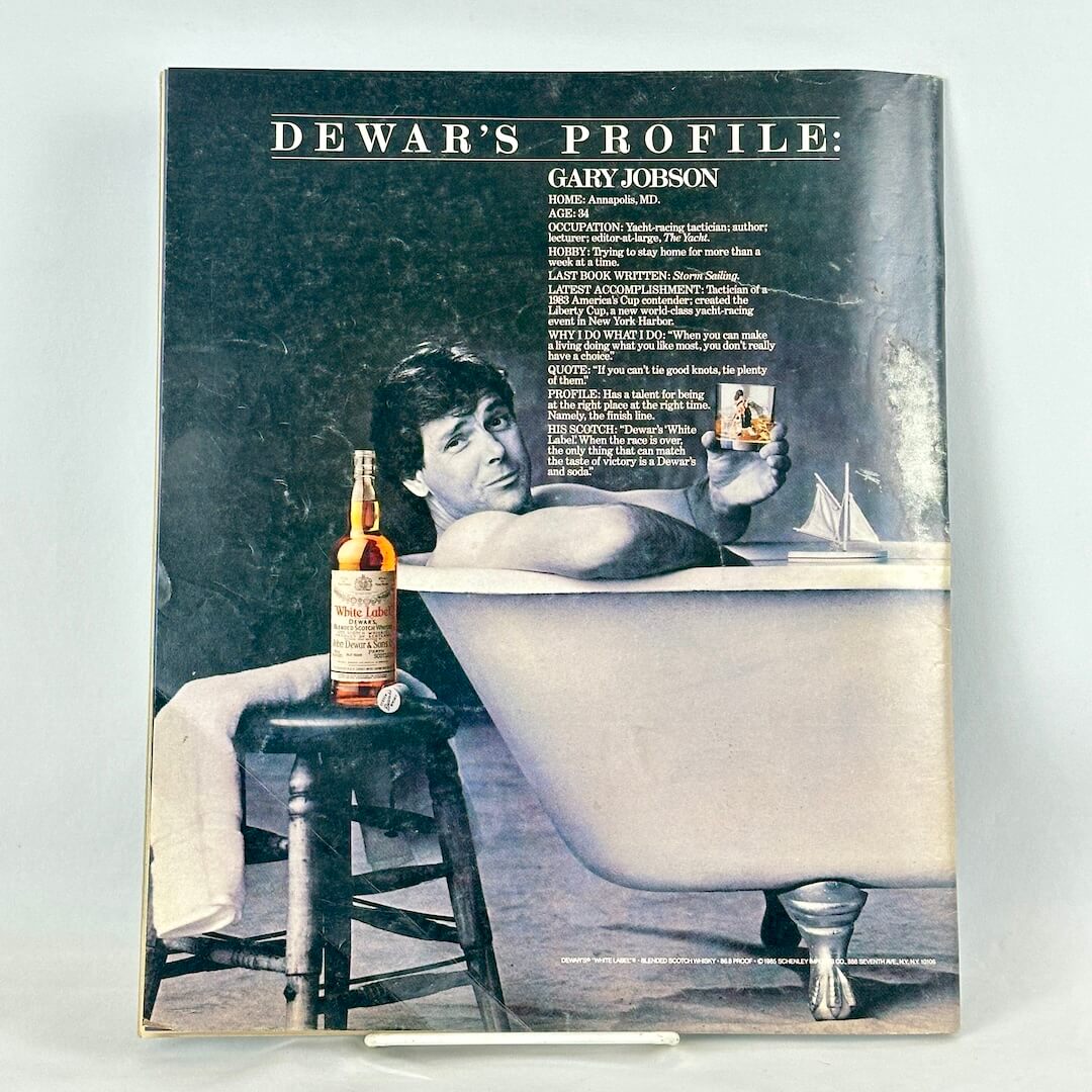 Back cover of magazine with full page ad for Dewer's featuring man in bathtub. 