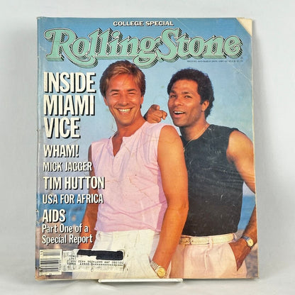 Vintage issue of Rolling Stone magazine with two smiling men on a beach on the cover. 