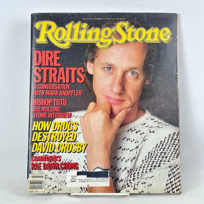 Vintage issue of Rolling Stone magazine with Mark Knopfler as cover subject, photographed on light background.