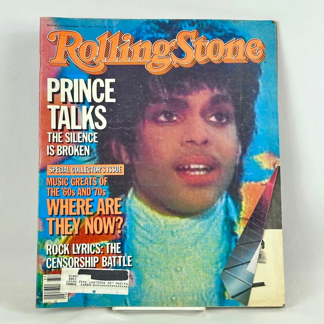 A vintage issue of Rolling Stone magazine featuring Prince on the cover, displayed on a white surface.