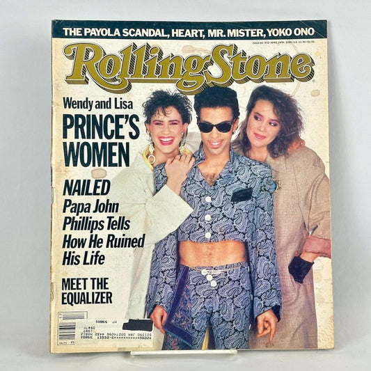 A vintage Rolling Stone magazine cover featuring two women posing together with Prince.