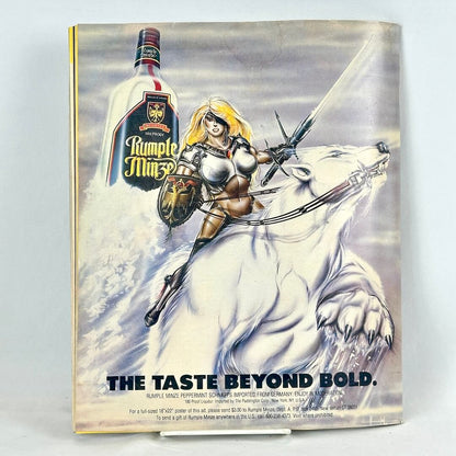 Back cover of magazine with full page ad for Rumple Minze liquor with warrior woman on the back of polar bear. 