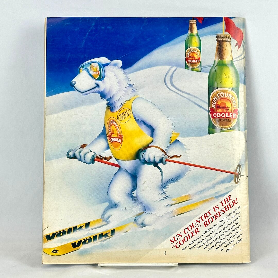 Back cover of magazine with full page ad for Sun Country Cooler drinks featuring illustration of skiing polar bear.