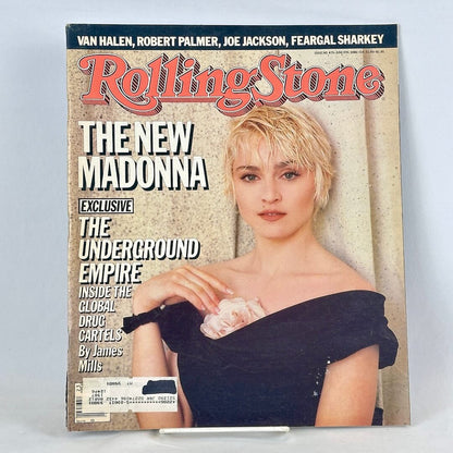 Vintage issue of Rolling Stone magazine with Madonna in black dress on cover. 