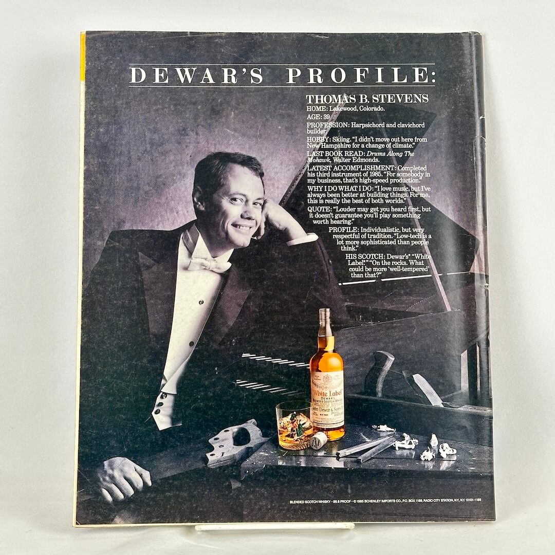 Back cover of magazine with full page ad for Dewar's whiskey featuring a profile of Thomas Stevens.
