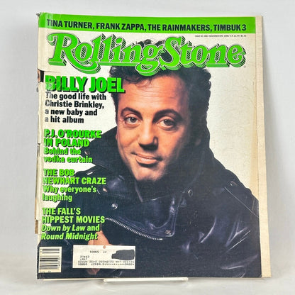 Vintage issue of Rolling Stone magazine with picture of Billy Joel on the cover. Logo in green. 
