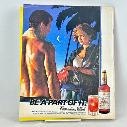 A vintage Canadian Club advertisement on back cover of magazine, featuring woman handing a shirtless man a drink.