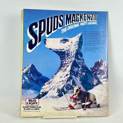 Back cover of magazine with full page ad for Bud Light featuring image of dog shaped mountain. 