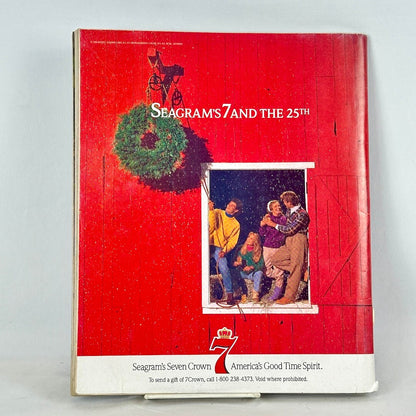 Back cover of magazine with full page ad for Seagrams 7 featuring people in holiday festive scene. 