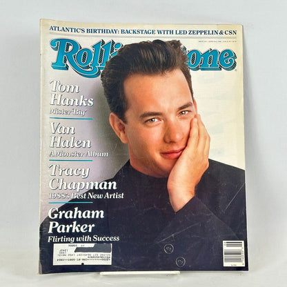 A vintage Rolling Stone magazine cover featuring Tom Hanks, photographed standing upright against a light gray background.